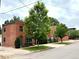 View of the building with lush greenery, showcasing its curb appeal and neighborhood charm at 2801 Champa St, Denver, CO 80205