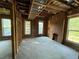 Bright interior features large windows, original brick, and exposed ceiling, perfect for customization or unique design at 2801 Champa St, Denver, CO 80205