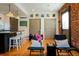 Inviting living area with hardwood floors, exposed brick, and stylish seating, perfect for relaxation at 2801 Champa St, Denver, CO 80205