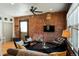 Cozy living room featuring exposed brick, modern furniture, and natural light, designed for comfort at 2801 Champa St, Denver, CO 80205