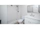 Beautiful bathroom features a sink, toilet, and shower with white tile at 9155 E Center Ave # 4B, Denver, CO 80247