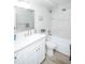 Bathroom with a tub, shower, toilet, vanity with sink, mirror, and wood-style vinyl flooring at 9155 E Center Ave # 4B, Denver, CO 80247