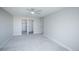 Large bedroom featuring new carpet with a large window, and bathroom and closet entrances at 9155 E Center Ave # 4B, Denver, CO 80247