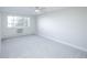 Bright bedroom with a ceiling fan and a large window provides plenty of natural light at 9155 E Center Ave # 4B, Denver, CO 80247