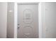 Unit front door shows classic detail and hardware at 9155 E Center Ave # 4B, Denver, CO 80247