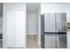 View of the kitchen featuring stainless steel appliances and a view to the hallway at 9155 E Center Ave # 4B, Denver, CO 80247