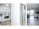 Open-concept living space showcasing a kitchen and sliding door that leads out to a balcony at 9155 E Center Ave # 4B, Denver, CO 80247