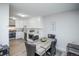 Open-concept living space showcasing a kitchen, dining table and an open living space at 9155 E Center Ave # 4B, Denver, CO 80247
