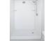 Clean white tiled stand up shower stall with a shower head and two shelves at 9155 E Center Ave # 4B, Denver, CO 80247