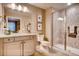 Bathroom featuring a shower with beautiful tile, modern fixtures, and a stylish vanity at 14115 Blue Stem St, Broomfield, CO 80020