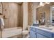 This bathroom is equipped with a tub, shower, toilet, vanity, sink, mirror, and stylish decor at 14115 Blue Stem St, Broomfield, CO 80020
