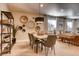 Stylish dining room featuring a dining table with seating, modern light fixture, and unique wall decor at 14115 Blue Stem St, Broomfield, CO 80020