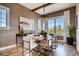 Stylish dining room featuring modern decor, large windows with bright light, and seating for six at 14115 Blue Stem St, Broomfield, CO 80020
