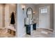 Welcoming foyer featuring decorative mirror, console table with stone floors and neutral paint at 14115 Blue Stem St, Broomfield, CO 80020