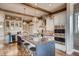 Spacious kitchen with stone countertops, modern appliances, and bar stool seating at 14115 Blue Stem St, Broomfield, CO 80020