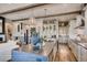 Spacious kitchen features an oversized island, hardwood floors, stone accents, and modern appliances at 14115 Blue Stem St, Broomfield, CO 80020