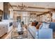 Spacious living room featuring a fireplace, modern decor, and seamlessly flowing open floor plan at 14115 Blue Stem St, Broomfield, CO 80020