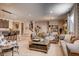 Spacious living room with stylish furniture, bar seating, open staircase, and a cozy atmosphere at 14115 Blue Stem St, Broomfield, CO 80020
