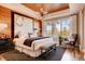 Luxurious main bedroom boasts a decorative ceiling, a large window, and designer furnishings at 14115 Blue Stem St, Broomfield, CO 80020