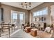 Bright home office featuring French doors, modern decor, and a comfortable workspace at 14115 Blue Stem St, Broomfield, CO 80020