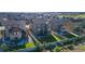 Aerial view showcasing a home's backyard with patio, dining area, and fenced yard in a suburban neighborhood at 12841 Galapago St, Westminster, CO 80234