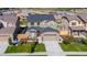 Aerial view of a two-story home with a manicured lawn and a two-car garage at 12841 Galapago St, Westminster, CO 80234
