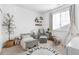 Cozy bedroom featuring a comfy bed, rocking chair, and play area with a fun ABC rug at 12841 Galapago St, Westminster, CO 80234