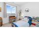 Charming bedroom featuring a fun Captain America themed bed and bright mountain views from the large window at 12841 Galapago St, Westminster, CO 80234