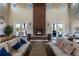 A beautifully designed clubhouse with comfortable seating, a fireplace, and access to outdoor amenities at 12841 Galapago St, Westminster, CO 80234