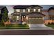 Beautiful two-story home featuring stone accents, a covered porch, and a two-car garage at 12841 Galapago St, Westminster, CO 80234