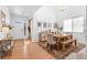 Inviting entryway flowing into a dining area with high ceilings and a large wooden table at 12841 Galapago St, Westminster, CO 80234