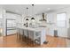 Spacious, modern kitchen with white cabinets, a large island, and stainless steel appliances at 12841 Galapago St, Westminster, CO 80234