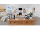 Cozy living room featuring a fireplace, built-in shelving, and a comfortable sofa at 12841 Galapago St, Westminster, CO 80234