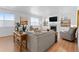 Inviting living room with plush seating, a fireplace, built-in shelves, and lots of natural light at 12841 Galapago St, Westminster, CO 80234