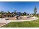 Community playground featuring a climbing rock, slide, and grassy surroundings at 12841 Galapago St, Westminster, CO 80234