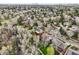 Beautiful aerial view of a home nestled in a neighborhood surrounded by mature trees at 8424 E Otero Cir, Centennial, CO 80112