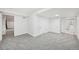 Finished basement featuring neutral carpeting and access to the bathroom and other rooms at 8424 E Otero Cir, Centennial, CO 80112