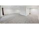 Large finished basement with neutral carpeting, recessed lighting and storage closet at 8424 E Otero Cir, Centennial, CO 80112
