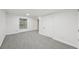 Finished basement featuring neutral carpeting and a window at 8424 E Otero Cir, Centennial, CO 80112