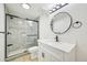 Nicely renovated bathroom featuring glass shower, modern lighting and a new vanity at 8424 E Otero Cir, Centennial, CO 80112
