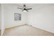 Light-filled bedroom featuring a window and ceiling fan at 8424 E Otero Cir, Centennial, CO 80112