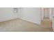 Bright bedroom featuring neutral carpeting, a window, and closet with folding doors at 8424 E Otero Cir, Centennial, CO 80112