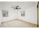 Bright bedroom with a ceiling fan, neutral walls and carpet, and large windows at 8424 E Otero Cir, Centennial, CO 80112