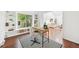 Charming home office with hardwood floors, built-in shelves, and great natural light for productivity at 8424 E Otero Cir, Centennial, CO 80112