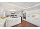 Modern kitchen with white cabinets, kitchen island, and an open concept design at 8424 E Otero Cir, Centennial, CO 80112
