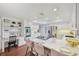 Bright and airy kitchen featuring a large island, white cabinetry and stainless steel appliances at 8424 E Otero Cir, Centennial, CO 80112