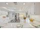 Well-lit kitchen featuring granite countertops, stainless steel appliances, and ample cabinet space at 8424 E Otero Cir, Centennial, CO 80112