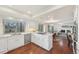 Open-concept kitchen with stainless steel appliances and eat-in counter seating at 8424 E Otero Cir, Centennial, CO 80112