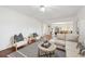 Spacious living room with open floor plan, stylish decor, and ample natural light at 8424 E Otero Cir, Centennial, CO 80112
