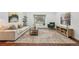 Sunlit living room showcasing hardwood floors, a large window, and neutral decor for a serene atmosphere at 8424 E Otero Cir, Centennial, CO 80112
